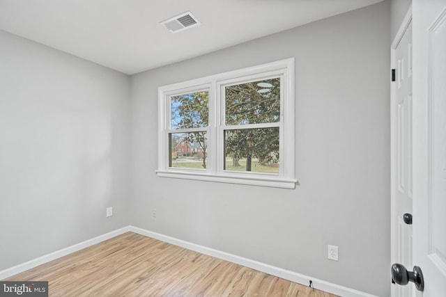 spare room featuring light hardwood / wood-style floors