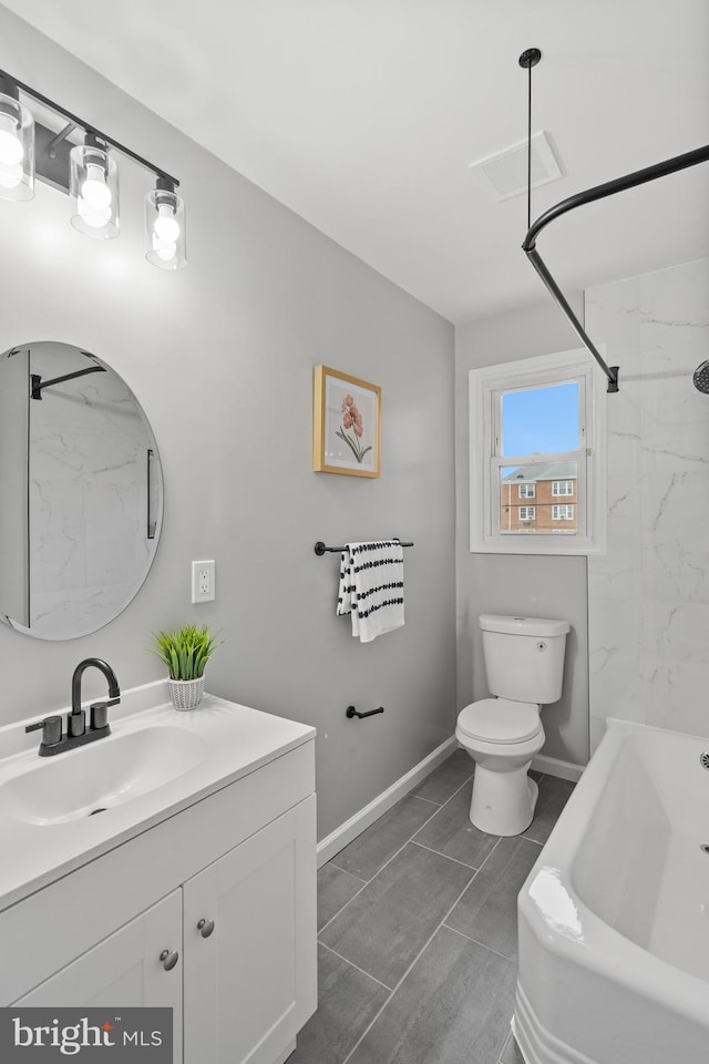 full bathroom with tile patterned flooring, vanity, toilet, and tiled shower / bath