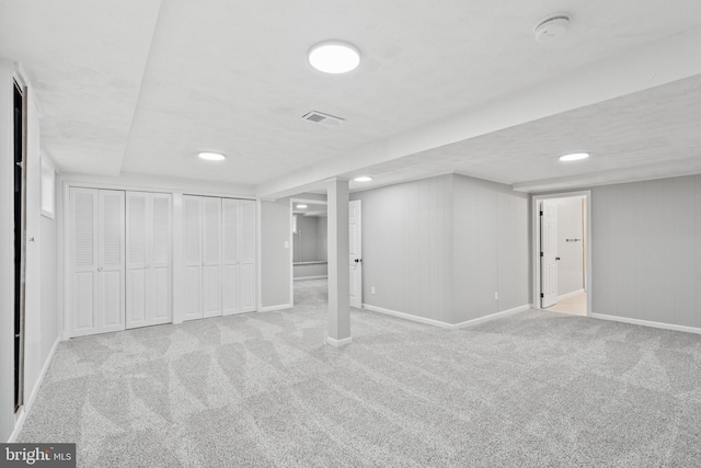 basement with light colored carpet