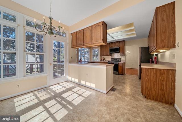 kitchen with stainless steel appliances, a peninsula, hanging light fixtures, light countertops, and brown cabinetry