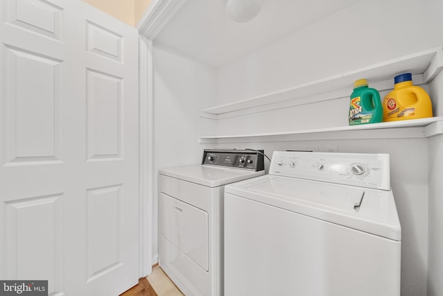 washroom with laundry area and washing machine and clothes dryer