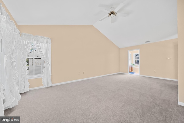 bonus room with light colored carpet, visible vents, baseboards, vaulted ceiling, and a ceiling fan