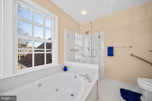 full bathroom with a garden tub, toilet, a stall shower, tile patterned flooring, and baseboards