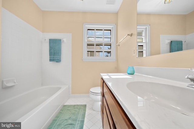 bathroom featuring toilet, visible vents, baseboards, vanity, and tile patterned floors