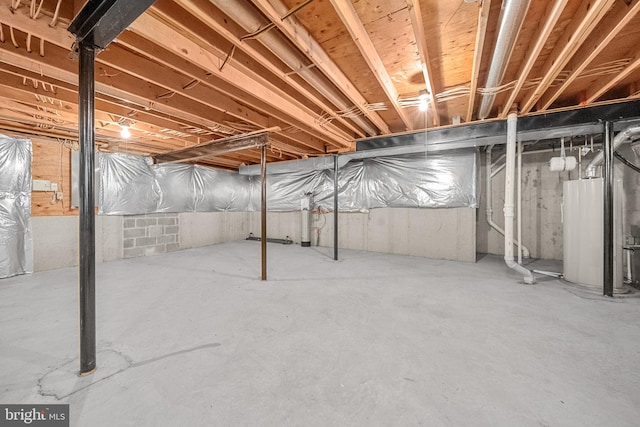 unfinished basement with water heater