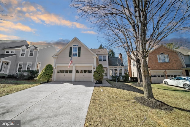 view of front of property featuring a yard, a residential view, and driveway