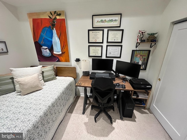 bedroom featuring light carpet