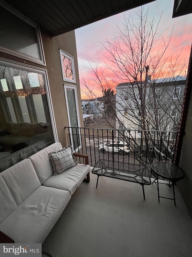 view of balcony at dusk