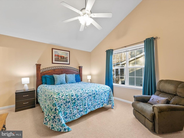 bedroom with ceiling fan, carpet, and high vaulted ceiling