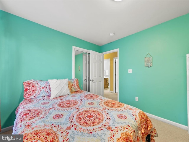 bedroom with a closet and carpet floors