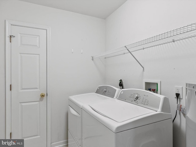 laundry area with independent washer and dryer