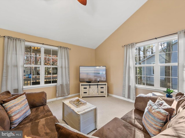 living room with carpet flooring, ceiling fan, and lofted ceiling