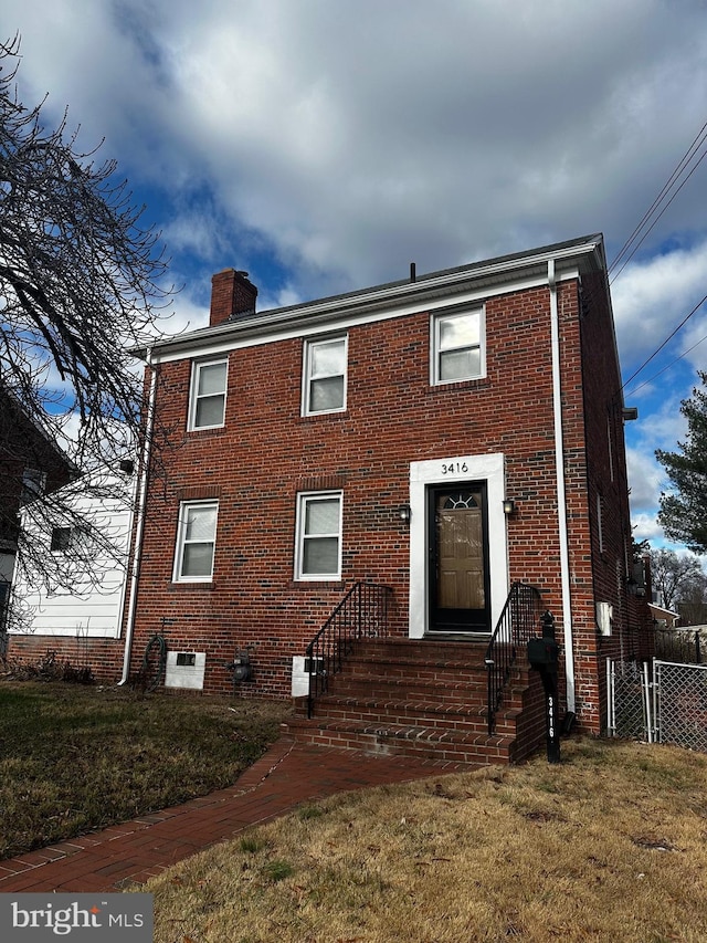 view of front of property with a front lawn