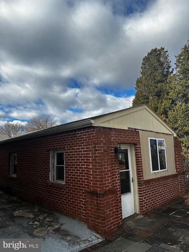 view of side of property featuring a patio