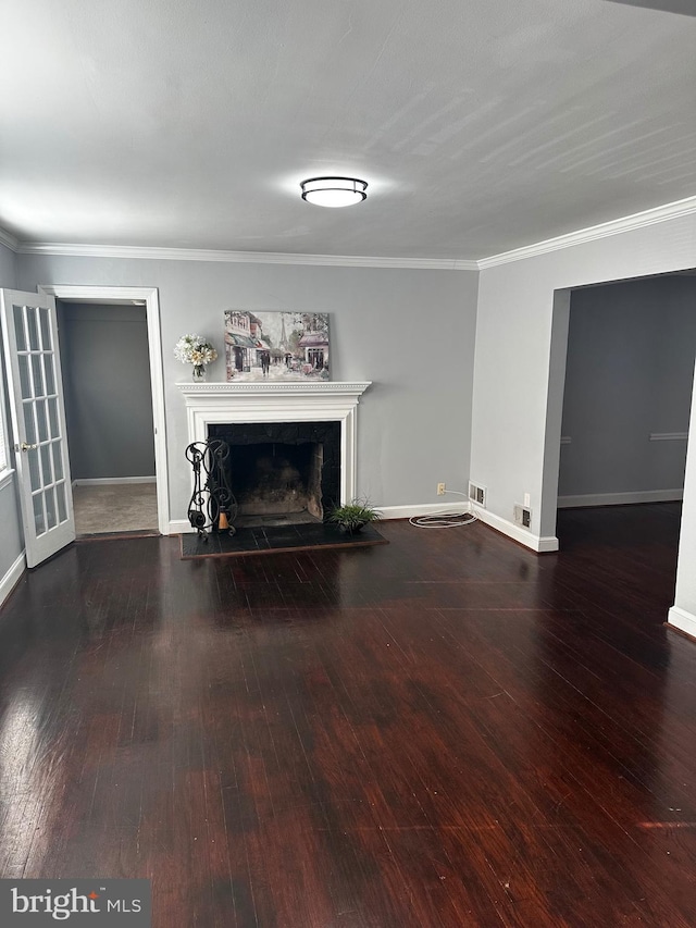 unfurnished living room featuring dark hardwood / wood-style floors and crown molding