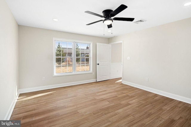 unfurnished room with light hardwood / wood-style flooring and ceiling fan