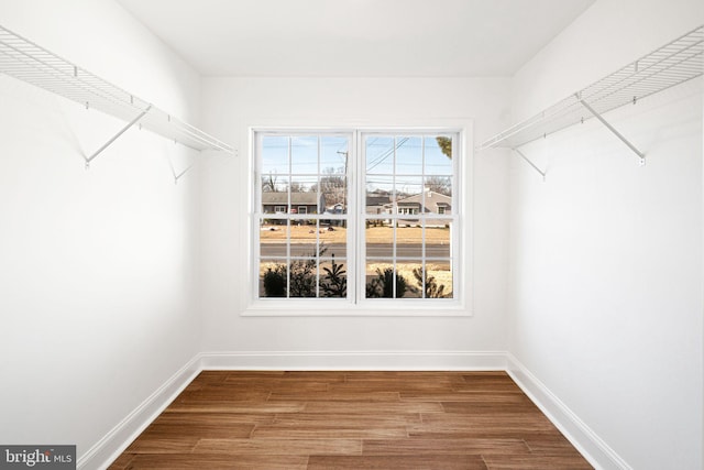 walk in closet featuring hardwood / wood-style flooring