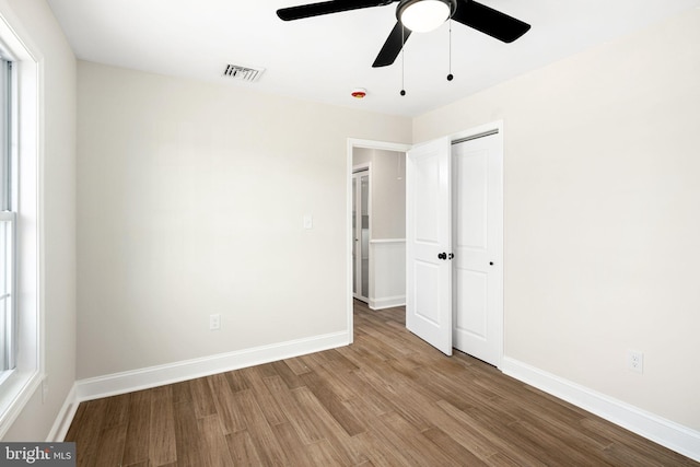 spare room featuring light wood-type flooring and ceiling fan