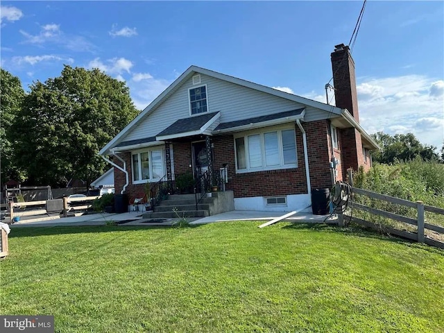 bungalow-style home with a front lawn