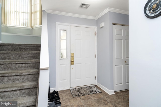 entryway featuring ornamental molding