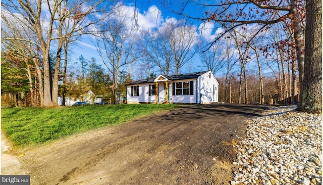 ranch-style house with a front yard