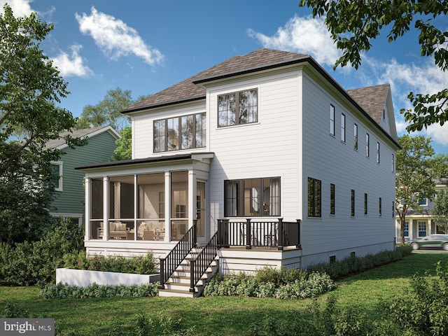 rear view of property featuring a lawn and a sunroom