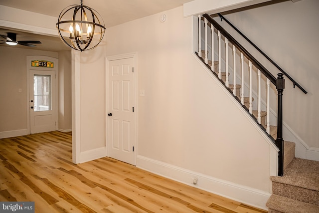 entryway featuring a notable chandelier and light wood-type flooring