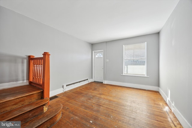 entrance foyer with wood-type flooring and baseboard heating