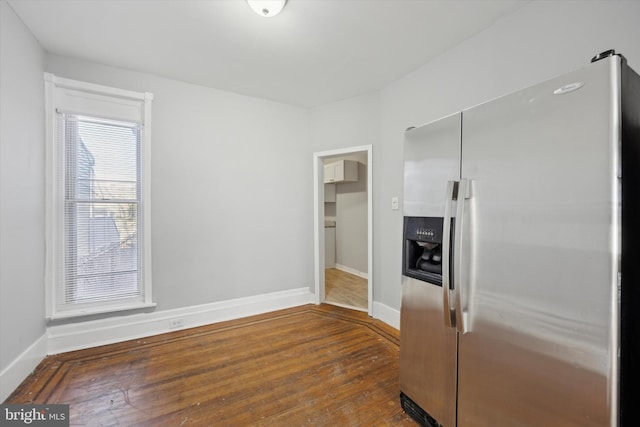 kitchen featuring stainless steel refrigerator with ice dispenser and dark wood-type flooring