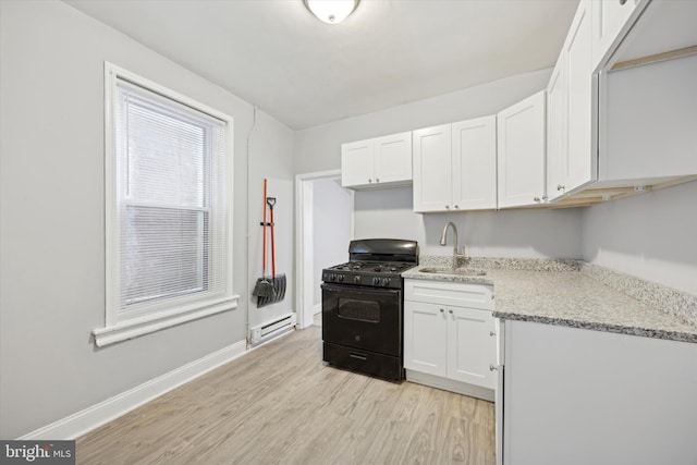 kitchen featuring sink, white cabinetry, black range with gas cooktop, and light wood-type flooring