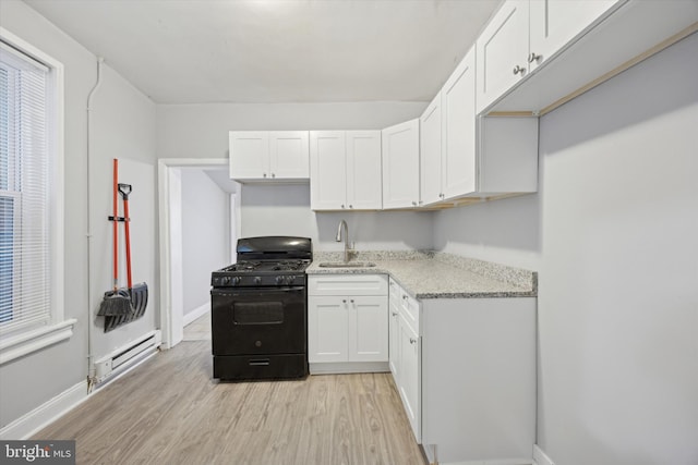 kitchen with black gas range, a baseboard heating unit, white cabinets, sink, and light hardwood / wood-style flooring