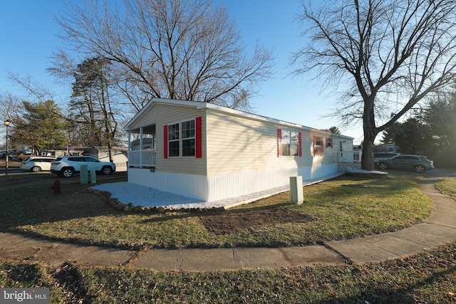 view of home's exterior with a yard