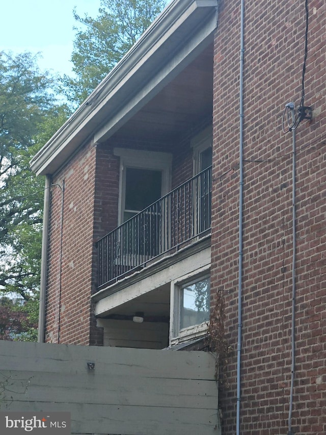 view of side of property with a balcony