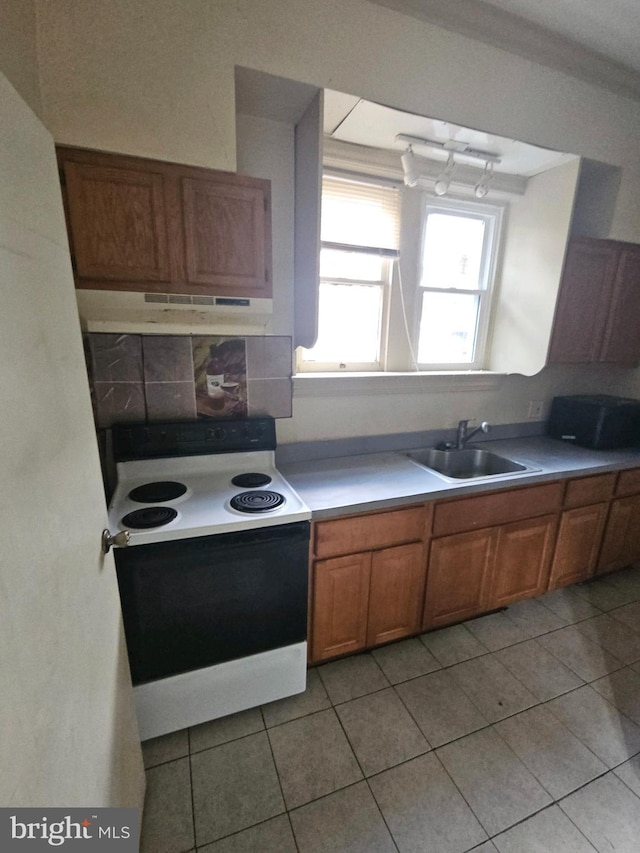 kitchen with sink, white electric range, tasteful backsplash, range hood, and light tile patterned flooring