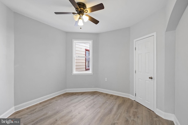 unfurnished room with ceiling fan and light wood-type flooring