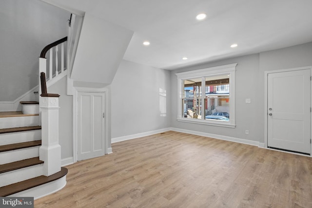 foyer entrance with light hardwood / wood-style floors