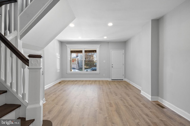 foyer entrance with light wood-type flooring