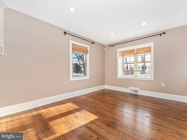 empty room featuring hardwood / wood-style floors