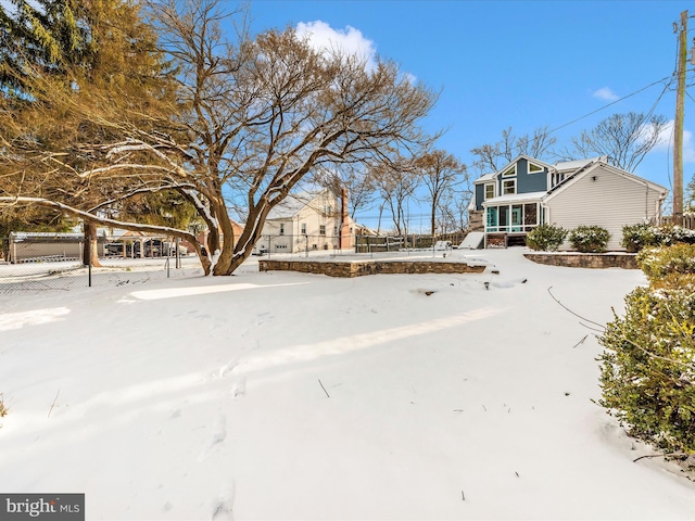 view of yard covered in snow