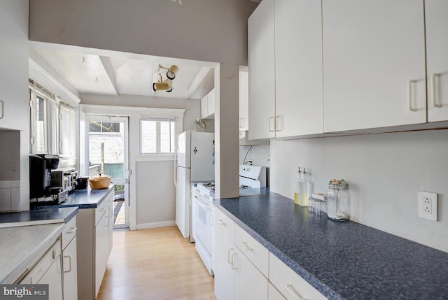 kitchen featuring white cabinets, white range, and light hardwood / wood-style flooring