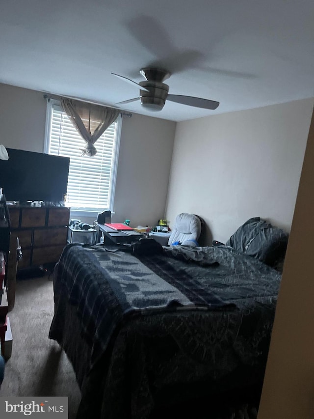 carpeted bedroom with ceiling fan