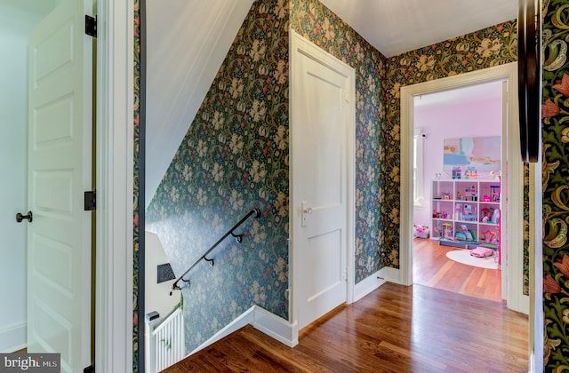 hallway with hardwood / wood-style floors