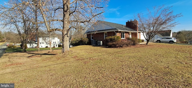 view of property exterior with a lawn