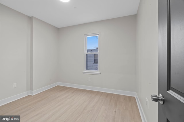 spare room featuring light hardwood / wood-style floors