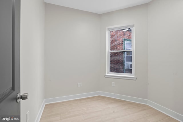 unfurnished room featuring light wood-type flooring