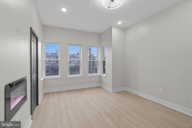 spare room with light wood-type flooring