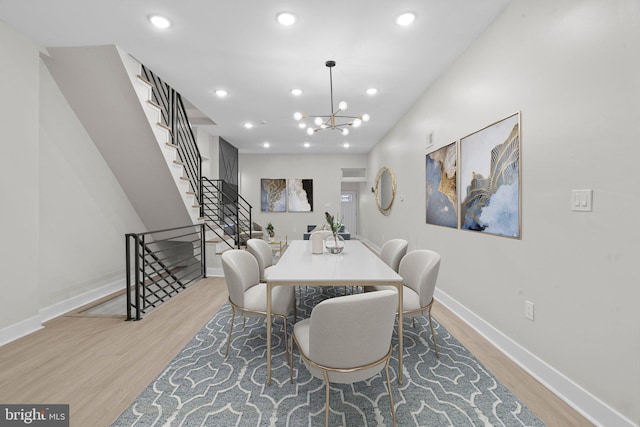 dining area featuring a chandelier and hardwood / wood-style flooring