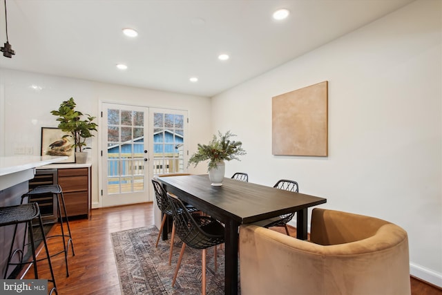 dining room with french doors and dark wood-type flooring