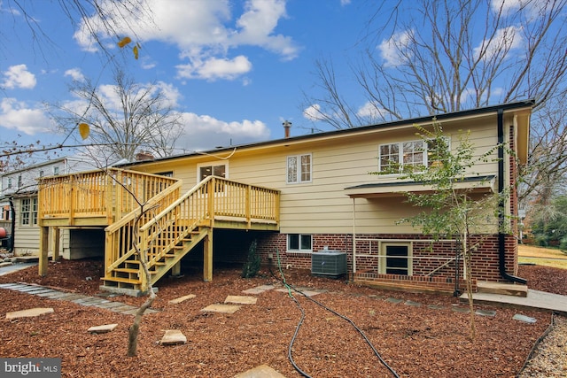 back of property with central air condition unit and a deck