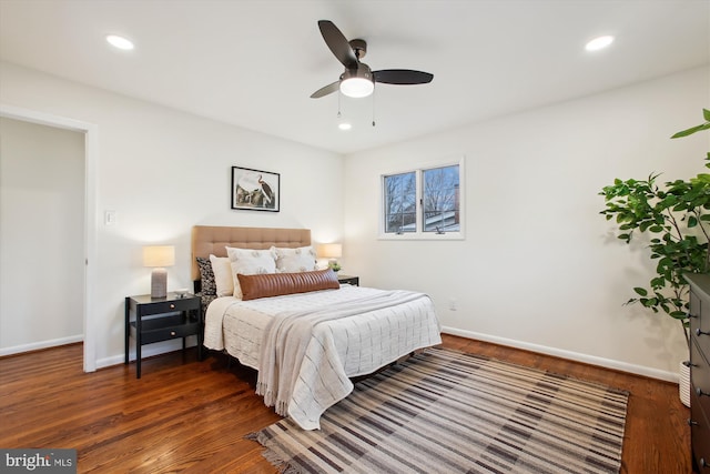 bedroom featuring ceiling fan and dark wood-type flooring